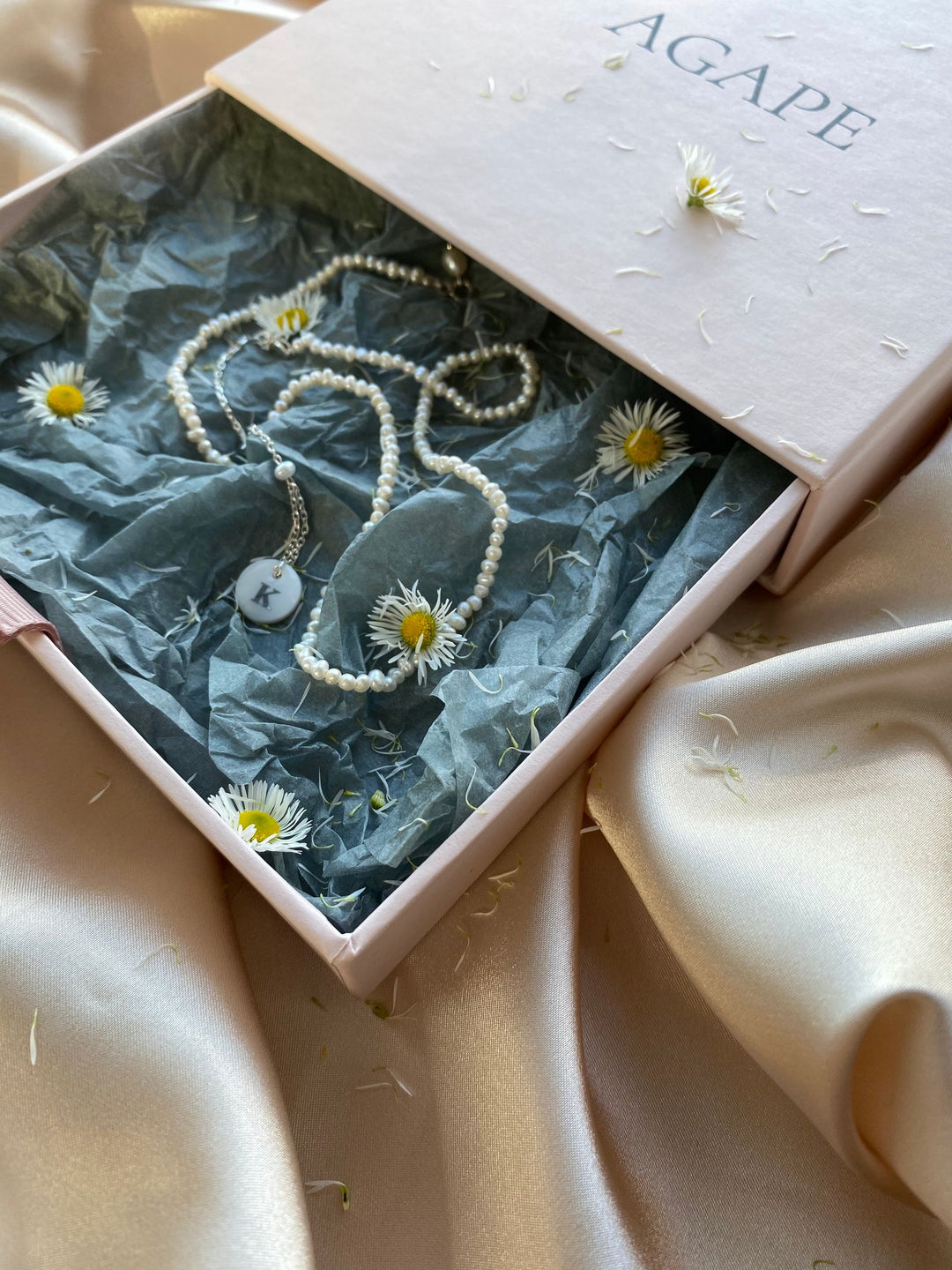 Pearl necklace presented in a jewelry box as a timeless heirloom