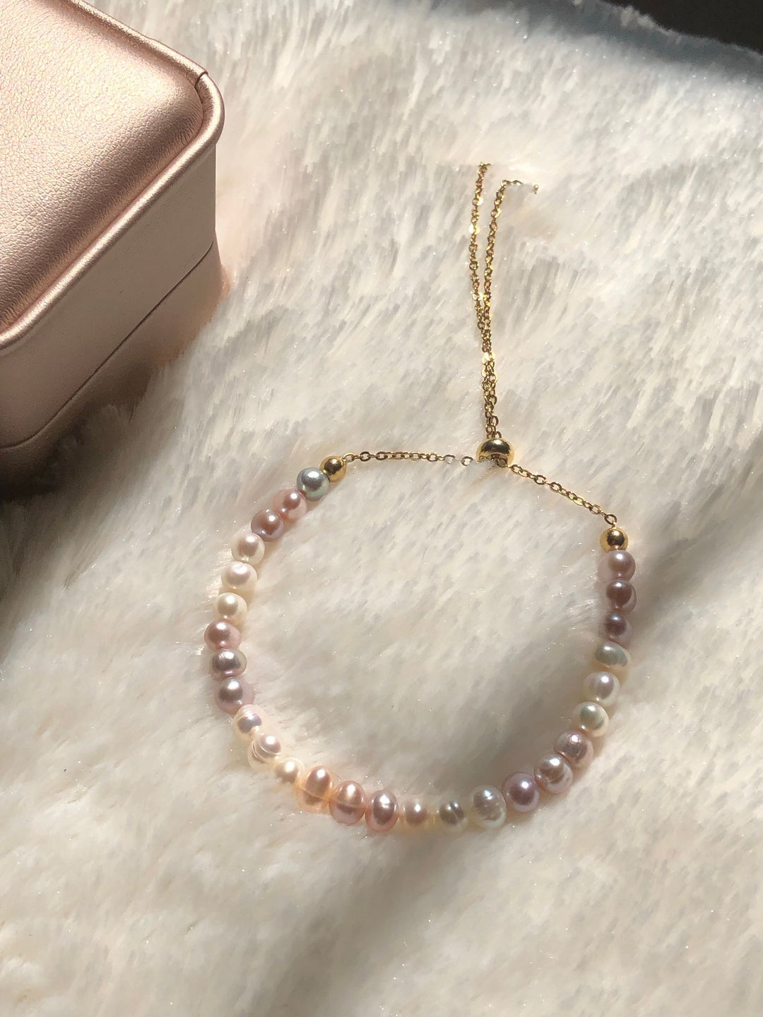 Organic pearl bracelet displayed on soft fabric